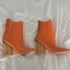 Orange high heeled boots